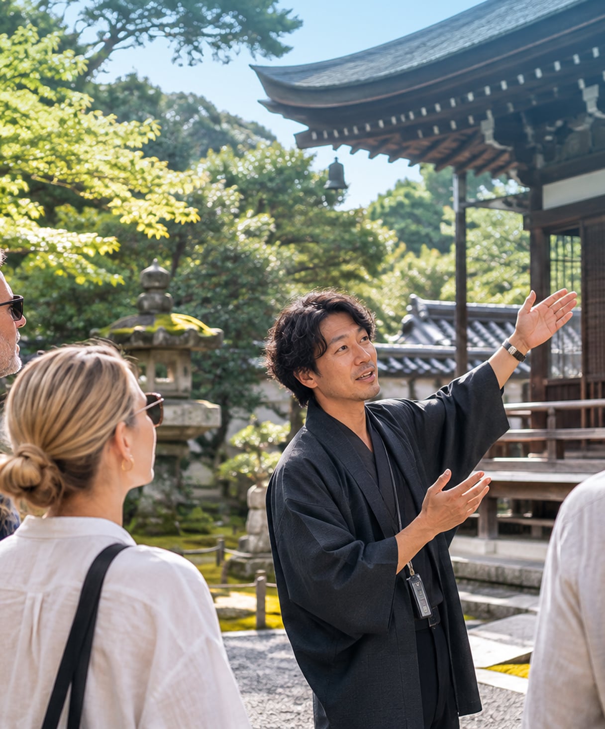 A temple guide leading visitors through a Kyoto temple garden